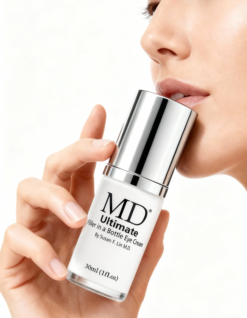 Beautiful woman with smooth under-eyes, showing MD Ultimate Eye Cream benefits for dark circles, fine lines, and radiant skin in MD Skin line